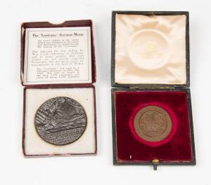 "LUSITANIA (German) Medal" (55mm) in fitted box with original papers; plus a "Queen's University, Kingston Canada" 1922 medallion (40mm) in plush box. (2 items)