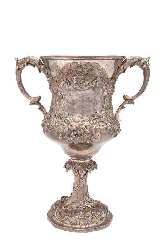 1888 COLOURED CHAMPION OF THE WORLD BOXING TROPHY, Victorian sterling silver two-handled trophy cup embossed with flowers & floral scrolls, hallmarked London 1860, with maker's mark "GE", engraved on front "PRESENTED to PETER JACKSON, COLOURED, CHAMPION B