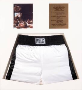 MUHAMMAD ALI, pair of 'Everlast' boxing shorts signed "Muhammad Ali AKA Cassius Clay", window mounted with photograph & plaque, framed & glazed, overall 88x95cm.