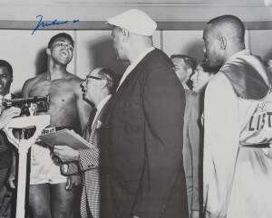 MUHAMMAD ALI, signed b/w photograph of Ali at weigh-in with Sonny Liston, size 51x41cm.