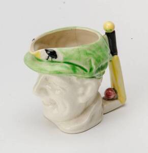 DON BRADMAN SMALL TOBY JUG, with cap in green, made by Marutomo Ware, 1934, 10cm high.