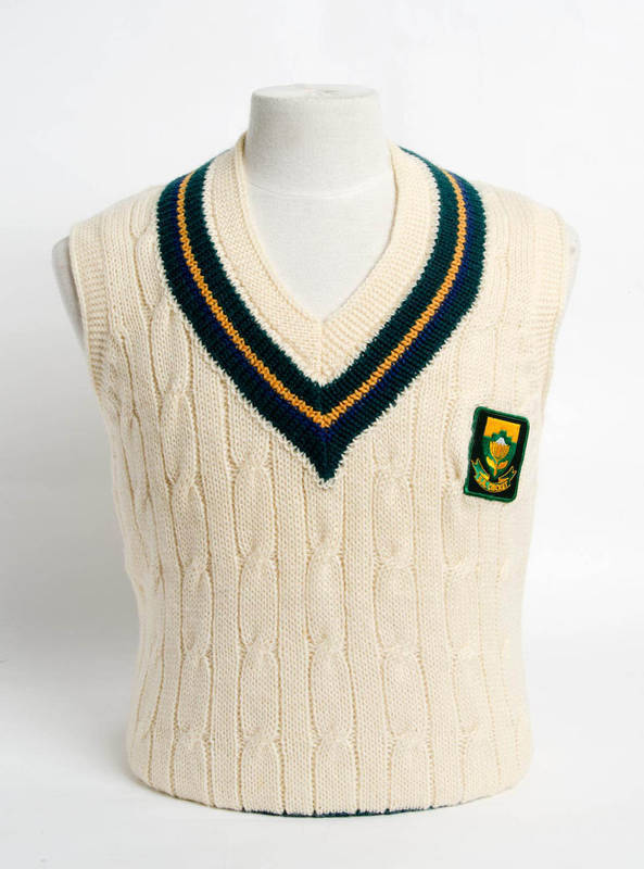 ANDREW HUDSON'S SOUTH AFRICA TEST JUMPER (sleeveless), with embroidered "SA Cricket" badge on front, endorsed on label "AH". Very Good condition. [Andrew Hudson played 35 Tests 1992-98].