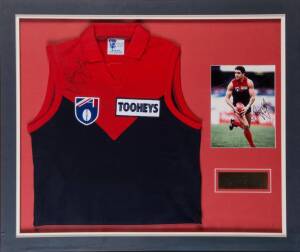 GARY LYON, display comprising signed Melbourne jumper, window mounted with action photograph and caption, framed & glazed, overall 80x85cm.