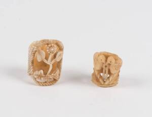 Two whalebone carved toggles. 19th Century. Largest 3cm.