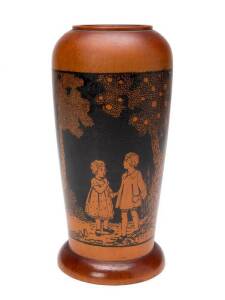 A turned huon pine vase with painted decoration in the style of Ida Rentoul Outhwaite, early 20th Century. 23cm