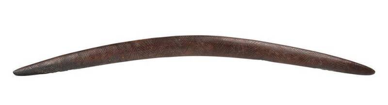 A Large Fighting Boomerang Club. Lake Eyre region, South Australia. Carved hardwood, circa 1900. 108 cm long. PROVENANCE: Private Collection, Melbourne.