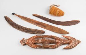 Group of tribal artifacts comprising a woomera, pandanus woven basket by June Wilfred circa 1987, 2 boomerangs, and a PNG painted food hook. (5 itmes)