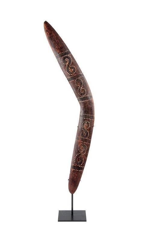 Boomerang, Kimberley region, Western Australia, natural earth pigments on carved wood, mid 20th Century. 74 cm high. PROVENANCE: Private Collection, Melbourne.