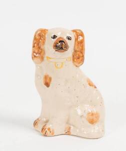 An Australian pottery spaniel by Una Deerbon, early 20th century. 11cm high. Una Deerbon was born Woollahra 1882 she studied under Julian Ashton. Her work was regarded as spontaneous and whimsical and her works are held by major Museums including the Powe