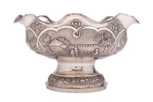 Anglo-Indian silver fruit bowl with repousse decoration, stamped "Mondhuroutt Showanipore Calcutta". 19th Century. 18cm high, 31cm wide. 