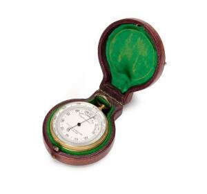 Pocket Barometer in a leather case lined with green velvet. Dial marked "Compensated. W. Littlejohn & Son Wellington". The front bezel rotates & is calibrated in feet. Late 19th Century. 5cm diameter