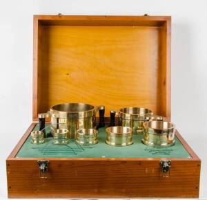 Set of 7 Victorian Government measures of capacity from Old Melbourne Observatory circa 1940. Gallon, half gallon, quart, pint, half pint, gill & half gill. In one box with glass strike discs. Each brass measure is hand engraved "Imperial Standard, Victor