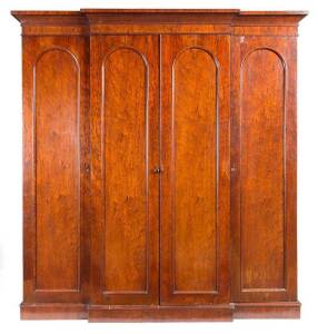 Australian cedar break front 4 door robe, with unusual selected cuts of butt cedar veneer, circa 1820/30s. See Fahy & Simpson, Australian Furniture Pictorial History and Dictionary, 1788-1938 (plate 574). Note: Originally attributed as 1850s we now believ