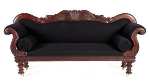 Double ended Australian cedar settee with Thomas Hope scroll back upholstered in a black woolen fabric, circa 1840. Height 102cm, with 220cm, depth 67cm