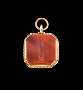 A carnelian intaglio fob, by Fischer of Geelong, the square intaglio depicting Fortuna, the reverse engraved C. F. Link, marked Fischer. Yellow gold. 22mm.