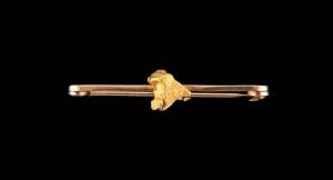 A gold nugget bar brooch. Marked 9ct. Length 50mm. Weight 3.77 grams.  