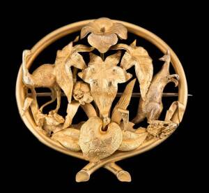 A Colonial gold brooch, circa 1860. Emu and Kangaroo in foliate surround, yellow gold, length 48mm. Similar example: Brilliant, Australian gold and silver 1851 - 1950, edited by Eva Czernis-Ryl p.18 & 23. Provenance: A private collection, London.