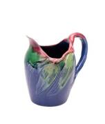 Remued pottery jug with applied gum leaves and branch handle, rare early colourway with usual incised decoration. Circa 1932 or 1933. 18.5 cm.