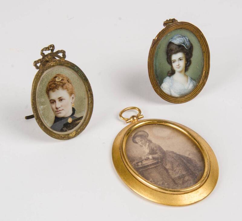 Three miniature portraits, two photographic and one painted on ivory, late 19th early 20th Century. Largest 5 x 6.5cm