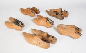 A collection of 21 antique wooden boot lasts in varying sizes