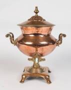 A Recency hot water urn, copper & brass with porcelain handles. 43cm high