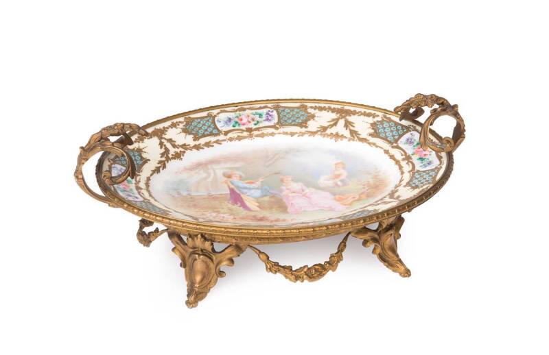 A Sevres porcelain comport with ormolu mount, French, late 19th/early 20th Century. 16cm high, 38cm wide, 24cm deep