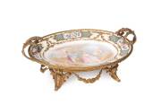 A Sevres porcelain comport with ormolu mount, French, late 19th/early 20th Century. 16cm high, 38cm wide, 24cm deep