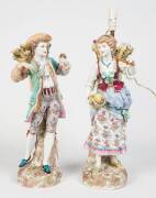 A pair of German figured porcelain lamps with Meissen marks, early 20th Century. Approximately 63cm each