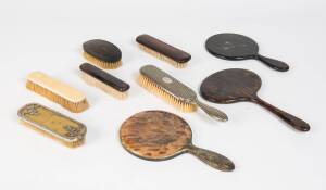 A collection of antique vanity ware including ivory, ebony & silver finished brushes, mirrors etc. 