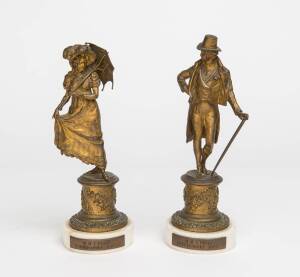 Two gilt bronze figures on circular marble bases signed C.Kauba. Inscribed on the brass plate M.D.I Preis, Purkersdof 1909. 24cm high