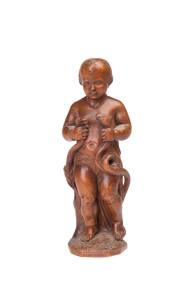 A European carved fruitwood statue of a putti holding two snakes, monogrammed "D.C.E" edition 2/9, 1915. 26cm high