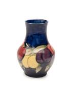 A Moorcroft "Wisteria" patterned vase, circa 1935. 12cm high