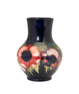 A Moorcroft anemone patterned baluster shaped vase, circa 1930s. 17cm high 