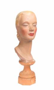 An Art Deco shop mannequin bust, painted plaster, circa 1920s (later wooden base). Bust 40cm high