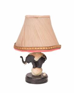 An Art Deco table lamp in the form of an elephant, cold painted spelter on timber plinth, circa 1920s. With shade 30cm high