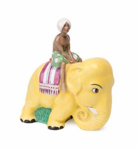 An Art Deco continental porcelain elephant statue with rider, circa 1930. 22cm high