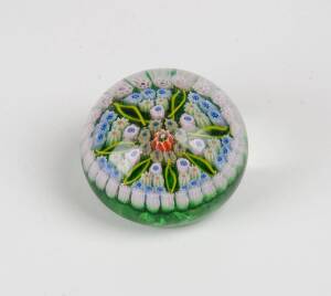 A millefiori glass paperweight, 20th Century. 6cm diameter