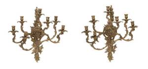 A pair of Louis XV style gilt brass wall sconces