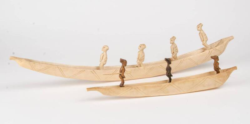 Two carved ivory canoes, Tanzania, early to mid 20th Century. 39.5cm & 62cm