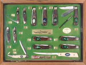 A Camillus "American Wildlife" series point of sale advertising display complete with fourteen knives and two steels housed in a timber finished case. Case 6cm high, 50cm wide, 39cm deep
