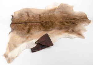 A deer skin & a leather pistol holster. Deer skin 110cm long, 102cm wide