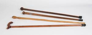 A group of 4 walking sticks including fiddleback blackwood with silver collar 