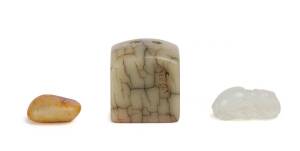 A group of Chinese jade and stone carvings including a white jade pendant carved in a pair of Hopewell immortals, 20th Century, D:5.8cm.