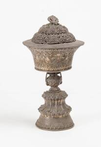 A Tibetan Buddhist temple lamp, silver. 20th Century, 31cm Height.