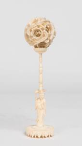 A Chinese ivory puzzle ball on stand, early 20th Century. 19cm 