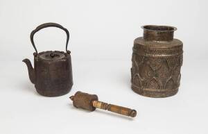 A Japanese iron teapot, plus a repousse metal jar & a prayer wheel. 19th Century & later. The jar 23cm high