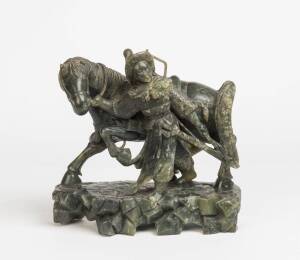 A Chinese spinach jade figure of a warrior & a horse. 20th Century. 27cm high