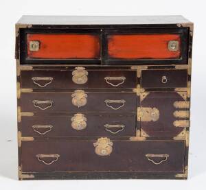 A Chinese elmwood lacquered four drawer chest with two sliding panels and brass fittings, late 19th/early 20th century78.5 high, 37cm wide, 72.5cm deepPROVENANCE: Purchased from Schoeni Fine Oriental Art, Hong Kong 