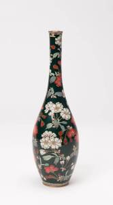 A Japanese cloisonné vase, Meiji period (1868-1912) with elongated neck, gold and silver wired decoration. Adorned with two-tones of Sakura cherry blossom, in bloom with multi-toned foliage. Applied on an opulent jade green ground. 24cm high