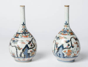 A pair of Japanese Imari bulbous bottle vases.